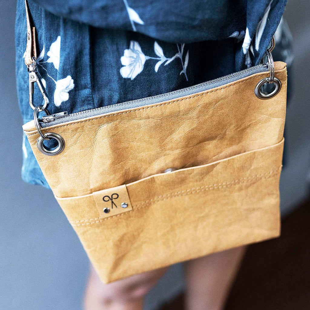 The Washable Paper crossbody shoulder bag is attractive enough to wear with your party dress and heels but casual enough to take when wearing your jeans and a T-shirt.